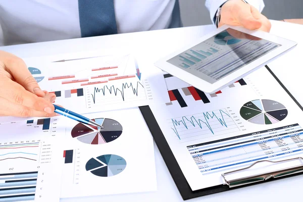 Close-up Of Businessman Analyzing Graphs on a digital tablet — Stock Photo, Image