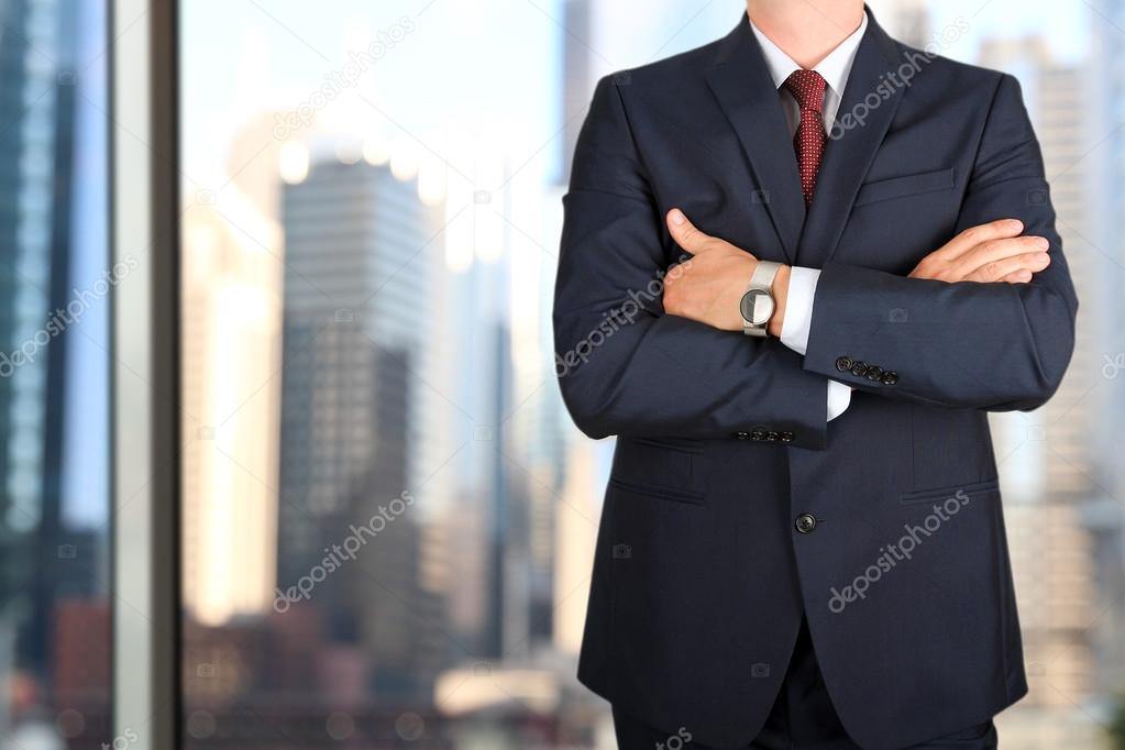 business and office concept -  elegant young fashion  buisness man in  a blue/navy suit 