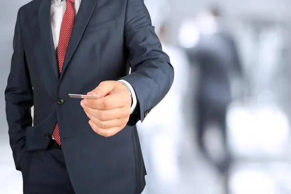 Closeup portrait of  businessman  giving  a  business card — Stock Photo, Image