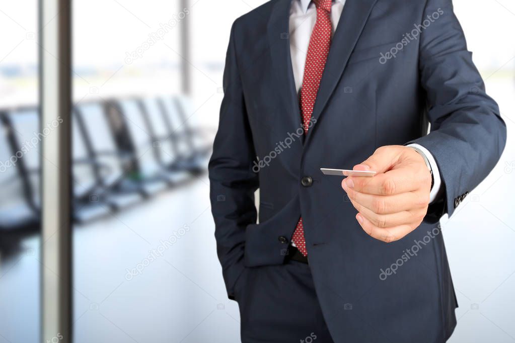 Closeup portrait of  businessman  giving  a  business card