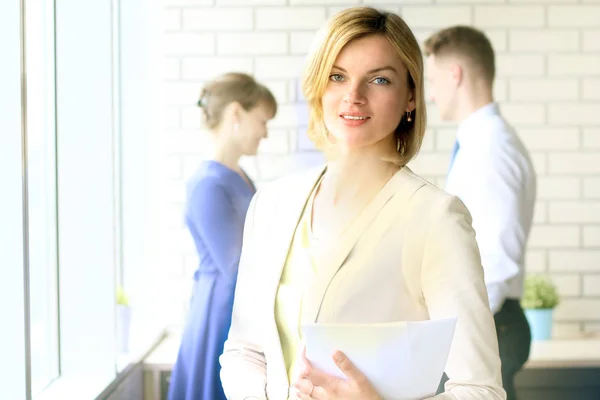 Beautiful business woman. business colleagues analyzing financial figures on a graphs — Stock Photo, Image