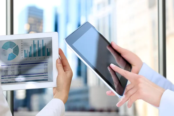 Business colleagues working and analyzing financial figures on a graphs — Stock Photo, Image