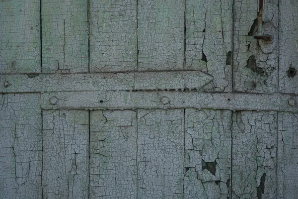 Bright wooden fence of separate wooden bars. Close up