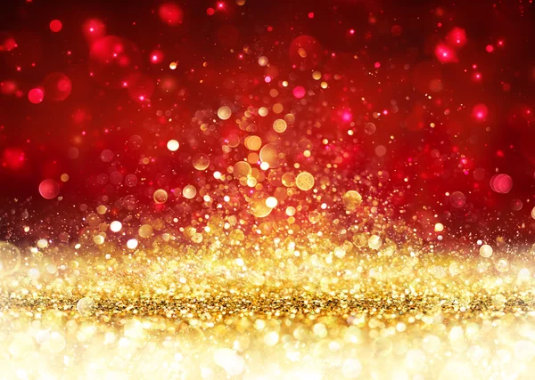 Fundo de Natal - Glitter dourado no vermelho brilhante — Fotografia de Stock