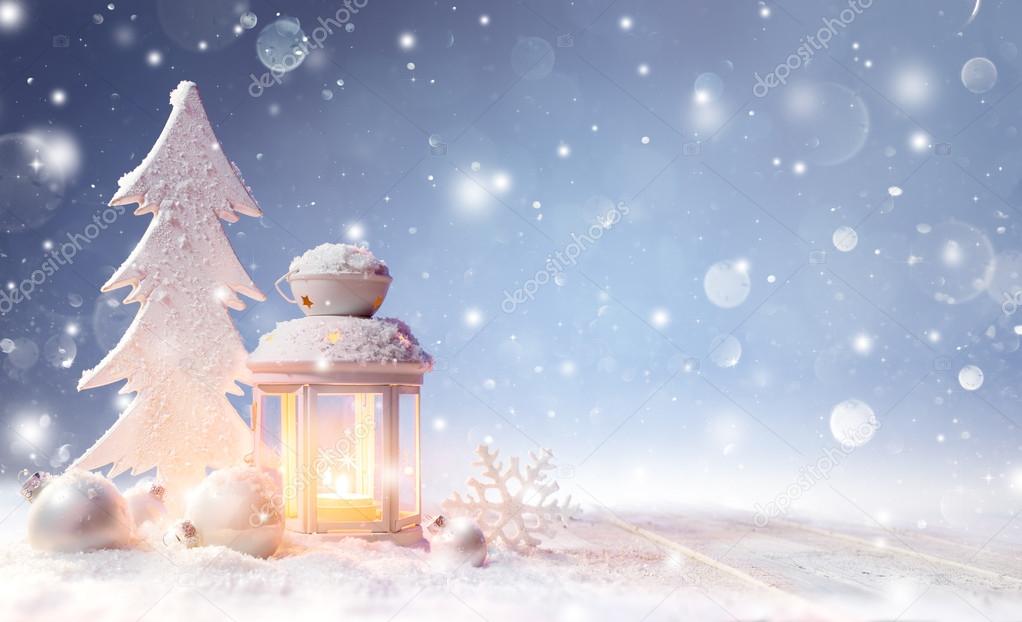 White Christmas Decoration With Lantern On Snowy Table And Shiny Snowfall