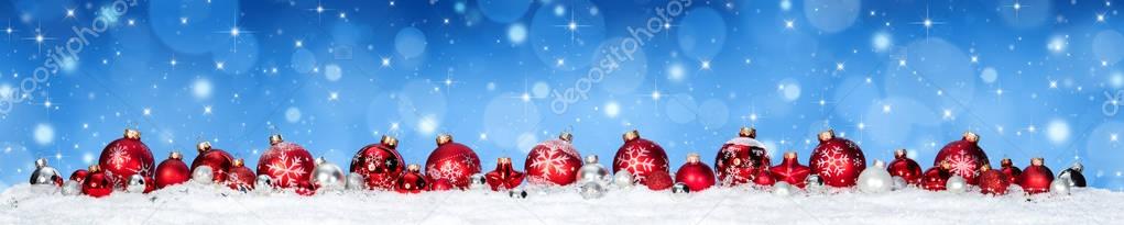 Red Baubles On Snow With Snowfall and Blue Heaven - Christmas Banner