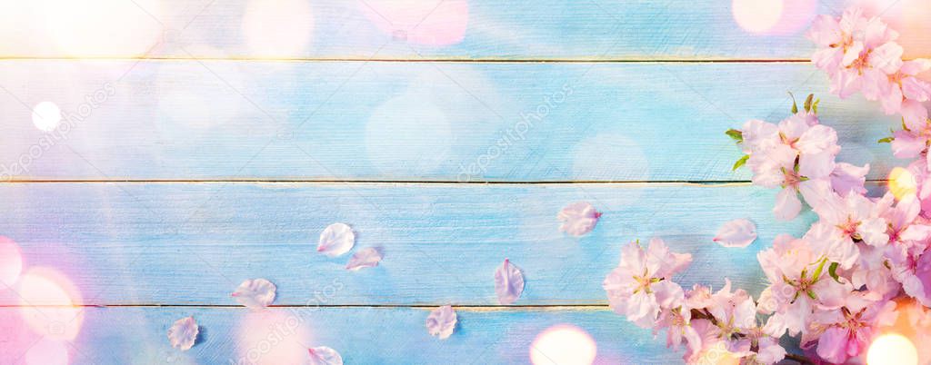 Almond Blossom On Blue Wooden Table