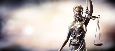Statue Of Lady Justice On Blurred Background clipart