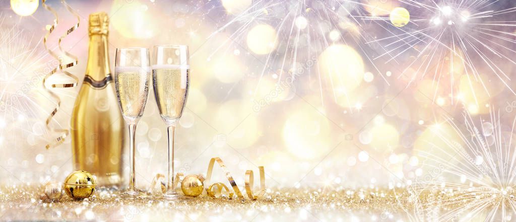 New Year Celebration With Champagne And Fireworks Golden Abstract Background