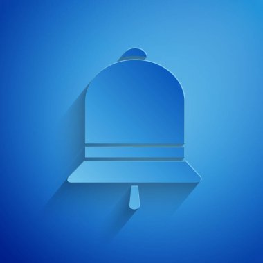 Kağıt kesme zil sesi mavi arka planda izole simgesi. Alarm sembolü, servis zili, el zili işareti, bildirim sembolü. Kağıt sanatı tarzı. Vektör Illustration