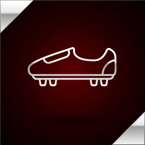 Stříbrná linka Fotbalová nebo fotbalová obuv s ikonou hroty izolované na tmavočerveném pozadí. Americká fotbalová bota. Vektorová ilustrace — Stockový vektor