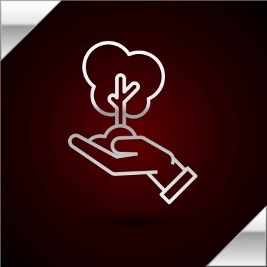 Çevre koruma ikonunun elindeki gümüş çizgi ağacı koyu kırmızı arka planda izole edilmiş. Tohum ve tohum. Fidan dikiyorum. Ekoloji konsepti. Vektör İllüstrasyonu