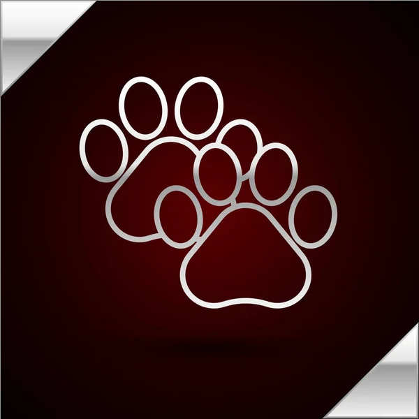 Silberne Linie Pfotendruck-Symbol isoliert auf dunkelrotem Hintergrund. Pfotenabdruck für Hund oder Katze. Tierspur. Vektorillustration — Stockvektor