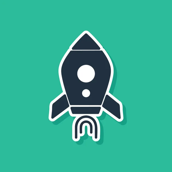 Blue Rocket ship with fire icon isolated on green background. Space travel. Vector Illustration
