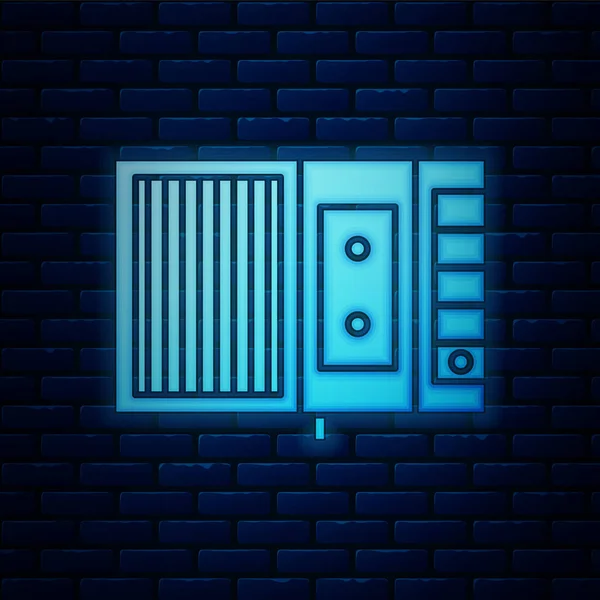 Ícone de leitor de fita de música de néon brilhante isolado no fundo da parede de tijolo. Dispositivo de música portátil. Ilustração vetorial —  Vetores de Stock