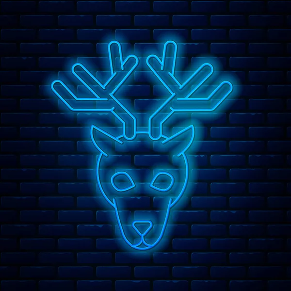 发光的霓虹灯线鹿头与鹿角图标隔离在砖墙的背景。 病媒图解 — 图库矢量图片
