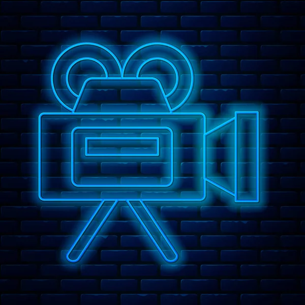 Linea neon incandescente icona della fotocamera Cinema isolato su sfondo muro di mattoni. Video camera. Segno cinematografico. Proiettore cinematografico. Illustrazione vettoriale — Vettoriale Stock