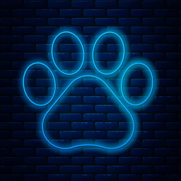 Glowing neon line Paw print icon isolated on brick wall background. Dog or cat paw print. Animal track. Vector Illustration — Stock Vector