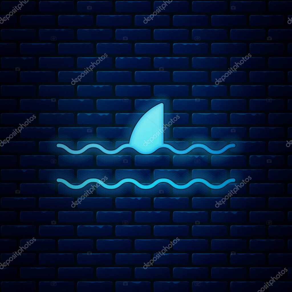 Glowing neon Shark fin in ocean wave icon isolated on brick wall background. Vector Illustration