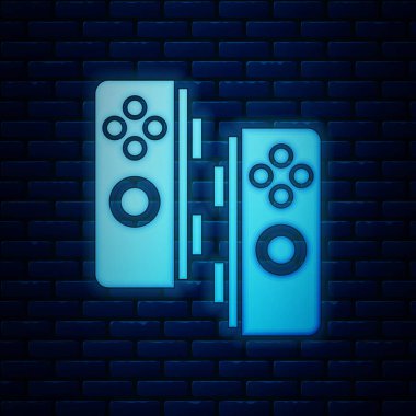 Parlayan neon oyun alanı simgesi tuğla duvar arka planında izole edildi. Oyun kontrolörü. Vektör İllüstrasyonu