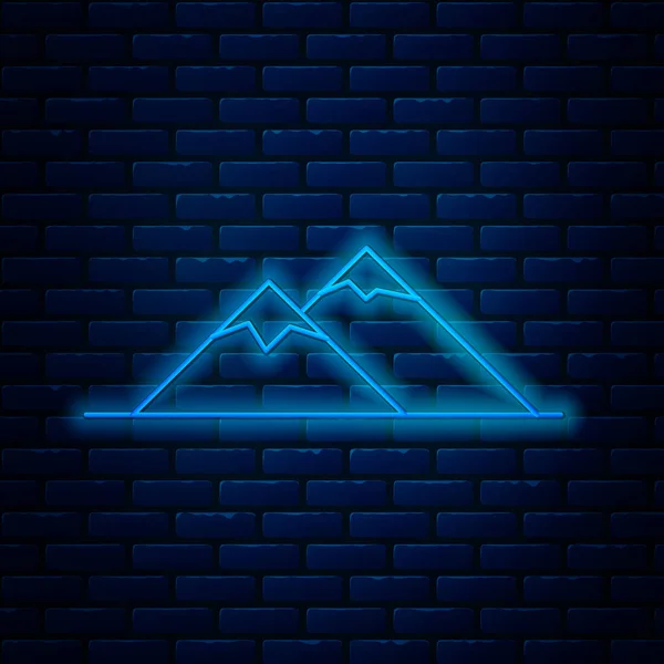 Leuchtende Neon-Linie Berge Symbol isoliert auf Backsteinwand Hintergrund. Symbol für Sieg oder Erfolg. Vektorillustration — Stockvektor