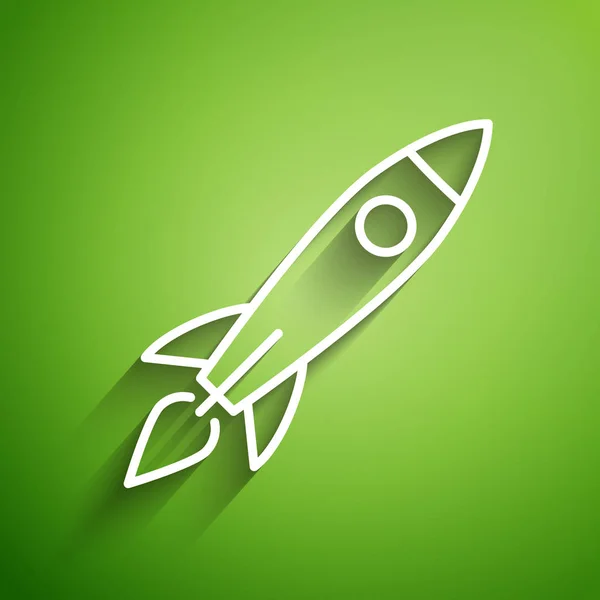 White line Rocket ship with fire icon isolated on green background. Space travel.  Vector Illustration