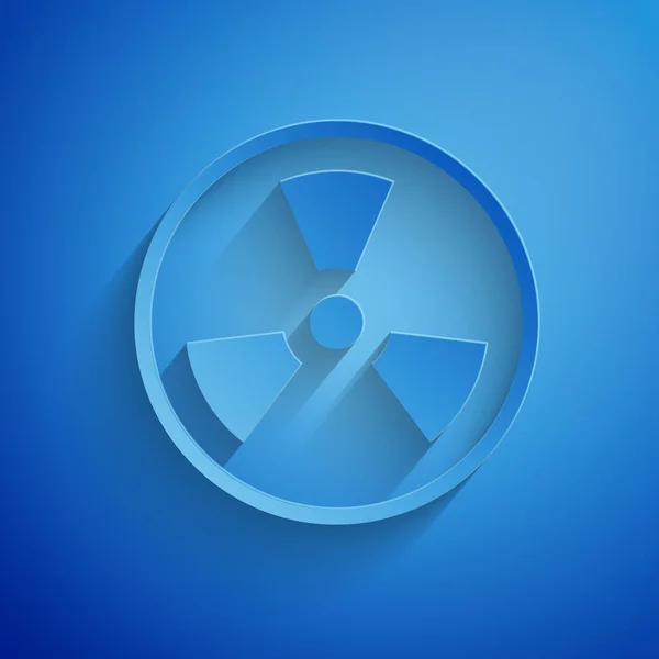 Papier gesneden Radioactieve pictogram geïsoleerd op blauwe achtergrond. Radioactief giftig symbool. Stralingsgevaar. Papierkunst stijl. Vector Illustratie — Stockvector
