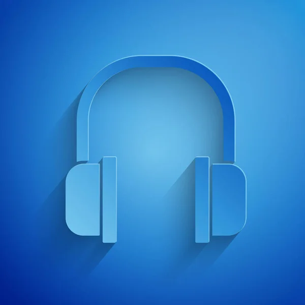 Pappersklipp hörlurar ikon isolerad på blå bakgrund. Hörlurar signera. Koncept för att lyssna på musik, service, kommunikation och operatör. Papperskonst. Vektor Illustration — Stock vektor