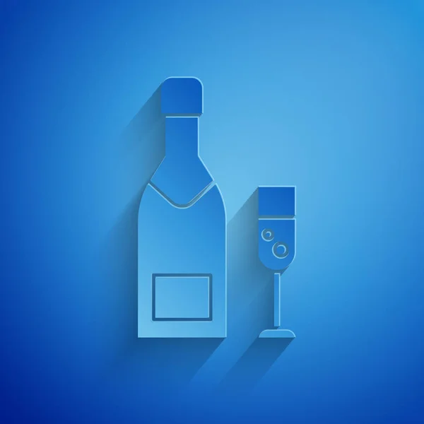 Paper cut Champagne bottle and glass of champagne icon isolated on blue background. Merry Christmas and Happy New Year. Paper art style. Vector Illustration — Stock Vector