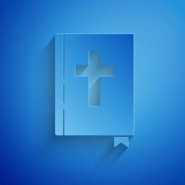 Papel cortado Icono del libro de la Sagrada Biblia aislado sobre fondo azul. Estilo de arte de papel. Ilustración vectorial — Vector de stock