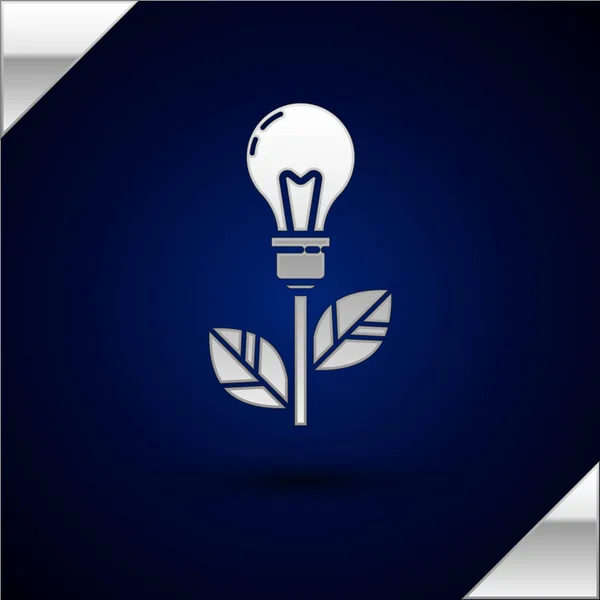 Silberne Glühbirne mit Blattsymbol auf dunkelblauem Hintergrund. Ökoenergiekonzept. alternative Energiekonzepte. Vektorillustration — Stockvektor