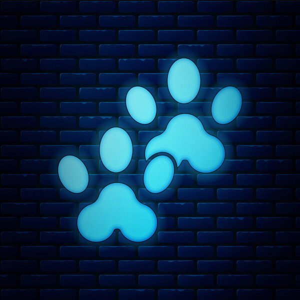 Glowing neon Paw print icon isolated on brick wall background. Dog or cat paw print. Animal track. Vector Illustration
