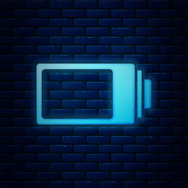 Svítící ikona indikátoru úrovně nabití baterie je izolovaná na pozadí cihlové zdi. Vektorová ilustrace — Stockový vektor