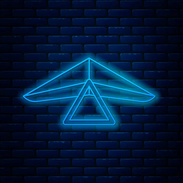 Gloeiende neon lijn deltavlieger pictogram geïsoleerd op baksteen muur achtergrond. Extreme sport. Vector Illustratie — Stockvector