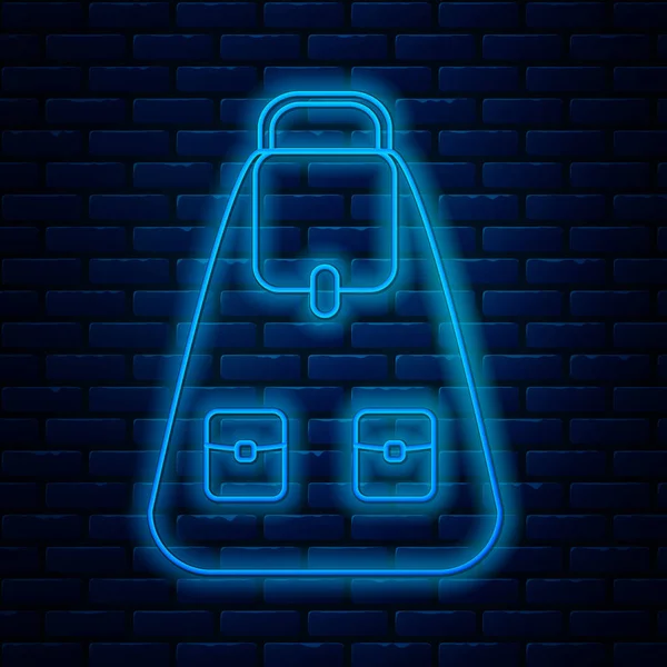 Linha de néon brilhante Ícone de mochila escolar isolado no fundo da parede de tijolo. Ilustração vetorial — Vetor de Stock