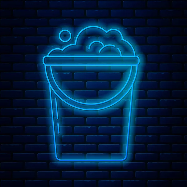 Glowing neon line Bucket with foam and bubbles icon isolated on brick wall background. Cleaning service concept. Vector Illustration — Stock Vector