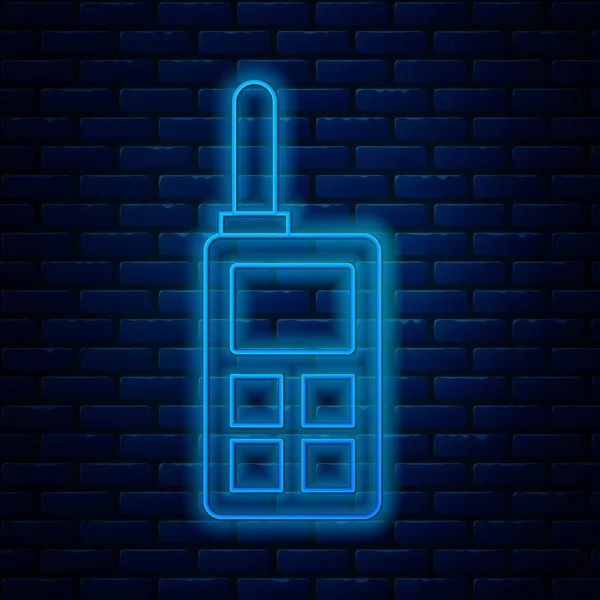 Glowing neon line Walkie talkie icon isolated on brick wall background. Portable radio transmitter icon. Radio transceiver sign. Vector Illustration — Stock Vector