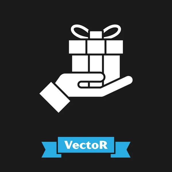 Weiße Geschenkbox in der Hand Symbol isoliert auf schwarzem Hintergrund. Frohe Weihnachten und ein gutes neues Jahr. Vektorillustration — Stockvektor