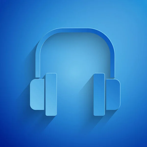 Icono de auriculares de corte de papel aislado sobre fondo azul. Auriculares. Concepto para escuchar música, servicio, comunicación y operador. Estilo de arte de papel. Ilustración vectorial — Archivo Imágenes Vectoriales