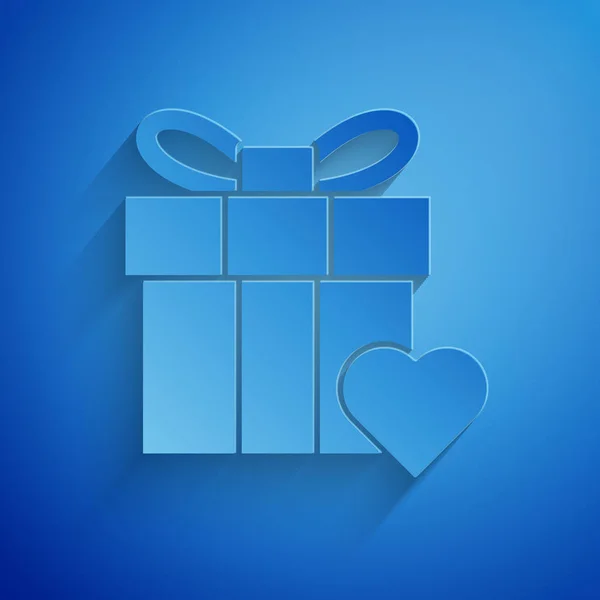 Corte de papel Caja de regalo e icono del corazón aislados sobre fondo azul. Día de San Valentín. Estilo de arte de papel. Ilustración vectorial — Vector de stock