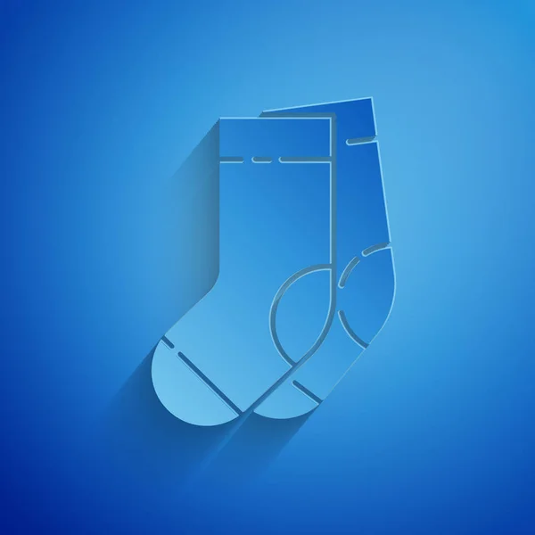 Paper cut Socks icon isolated on blue background. Paper art style. Vector Illustration — Stock Vector