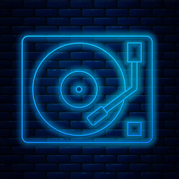 Gloeiende neon lijn Vinyl speler met een vinyl disk icoon geïsoleerd op bakstenen muur achtergrond. Vector Illustratie — Stockvector