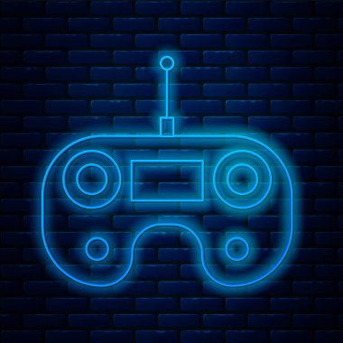 Parlayan neon hattı uzaktan kumanda simgesi tuğla duvar arka planında izole edildi. Vektör İllüstrasyonu