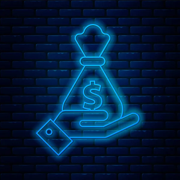 Žhnoucí neonová čára Ruka držící ikonu tašky na peníze izolované na pozadí cihlové zdi. Symbol Dollar nebo Usd. Cash Banking currency sign. Vektorová ilustrace — Stockový vektor