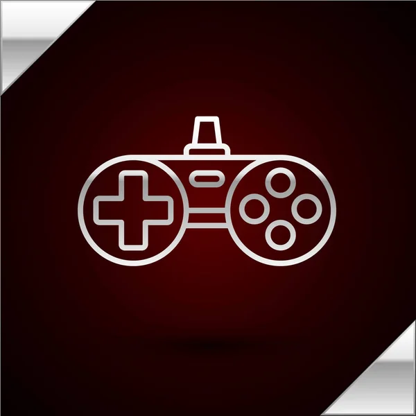 Ícone Gamepad linha de prata isolado no fundo vermelho escuro. Controlador de jogo. Ilustração vetorial — Vetor de Stock