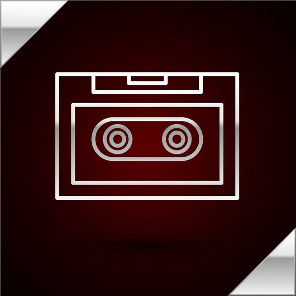 Línea plateada Icono de cinta de audio retro aislado sobre fondo rojo oscuro. Ilustración vectorial — Vector de stock