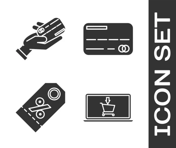 Définir Panier d'achat sur ordinateur portable à l'écran, Tenue de main humaine avec carte de crédit, Étiquette de pourcentage de réduction et icône de carte de crédit. Vecteur — Image vectorielle