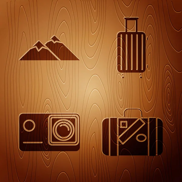 Set Suitcase for travel and stickers, Mountains, Action extreme camera and Suitcase for travel on wooden background. Vector — Stock Vector
