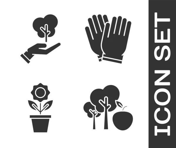 Set Tree with apple, Tree in hand of environmental protection, Flower in pot and Garden gloves icon. Vector — 스톡 벡터