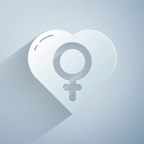 Папір вирізав жіночу стать в серці ікони ізольовані на сірому фоні. Венера символ. Символ жіночого організму або жінки. Паперовий стиль. Векторний приклад — стоковий вектор